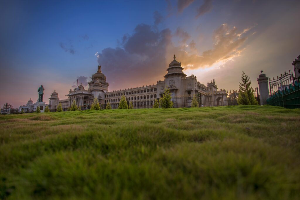 Bangalore Palace, Capture of Vidhana Soudha in Bengaluru with a vibrant sunset sky, showcasing beautiful architecture.